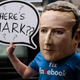 A protester wearing a model head of Facebook CEO Mark Zuckerberg poses for media outside Portcullis House on November 27, 2018 in London, England.